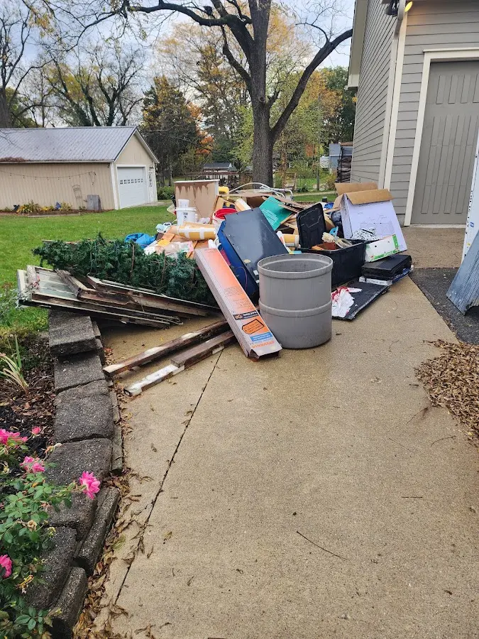 Dumpster being loaded with debris for Residential Dumpster Rental in Worcester